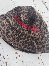 Load image into Gallery viewer, &quot;Iechyd Da&quot; leopard print bucket hats! Pre-order yours NOW to get the first delivery drop between 20th-22nd October!!!
