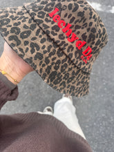 Load image into Gallery viewer, &quot;Iechyd Da&quot; leopard print bucket hats! Pre-order yours NOW to get the first delivery drop between 20th-22nd October!!!
